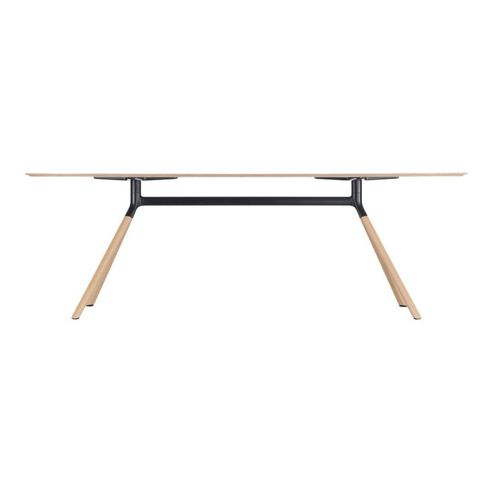 Light wood table with a smooth, natural finish and black metal accents, featuring a minimalist design.