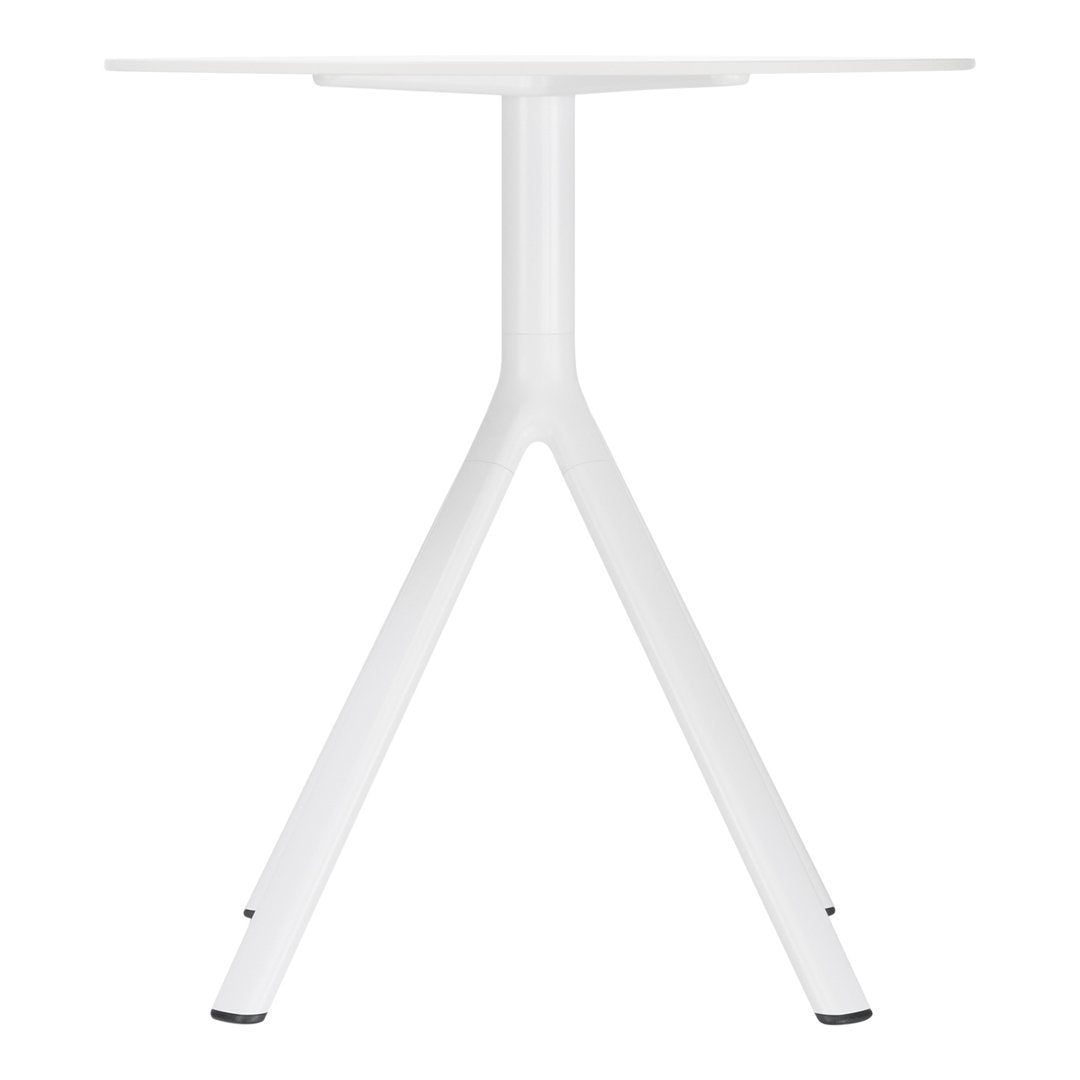 Modern white table with a minimalist design and sleek, angular legs. Ideal for contemporary spaces.