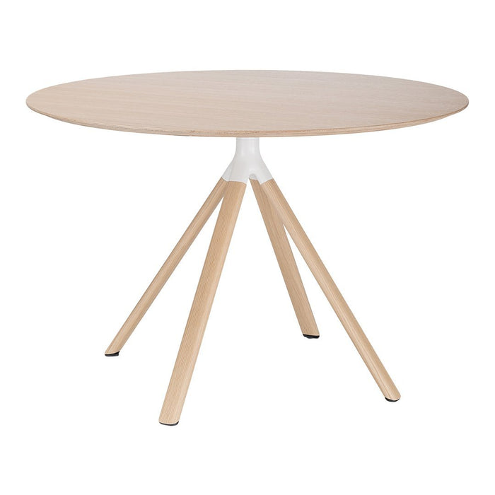 Round wooden table with light natural finish and white base, featuring sleek, minimalist design and simple color palette.