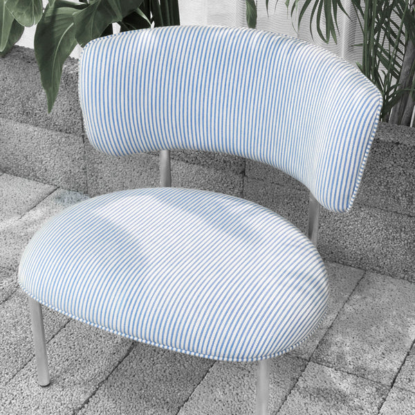 Blue and white striped chair with a modern, curved design against a textured backdrop.