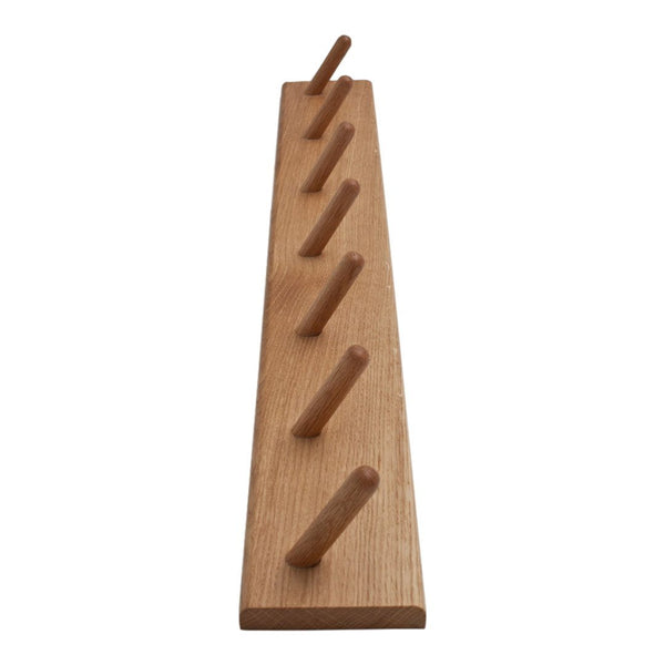 Natural wood wall rack with a smooth finish and six evenly spaced pegs, showcasing a warm beige tone.