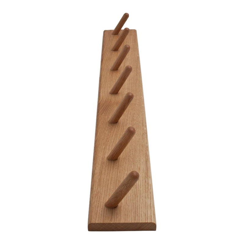 Natural wood wall rack with a smooth finish and six evenly spaced pegs, showcasing a warm beige tone.