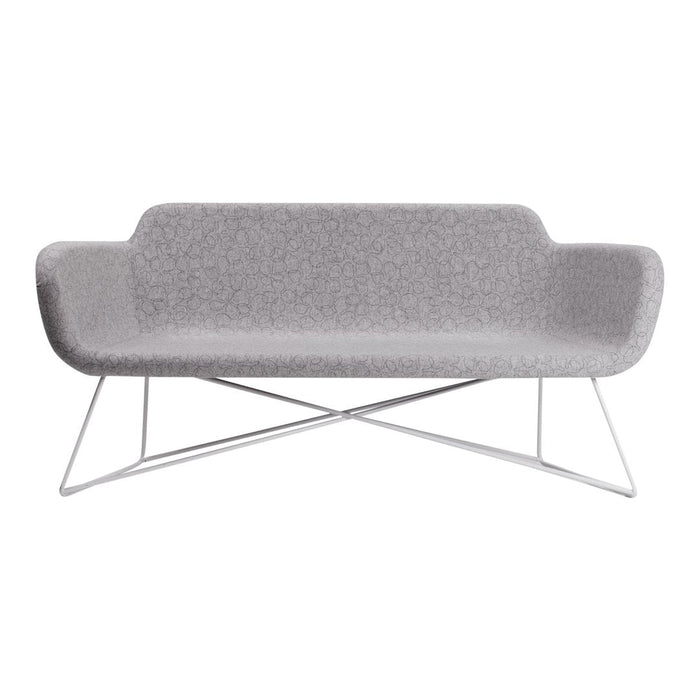 Gray upholstered sofa with a smooth, minimalist design and sleek stainless steel legs. Modern aesthetic for any space.
