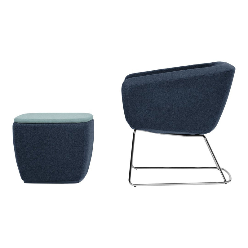 Navy blue upholstered chair and ottoman with a sleek, modern design and minimalist patterns.