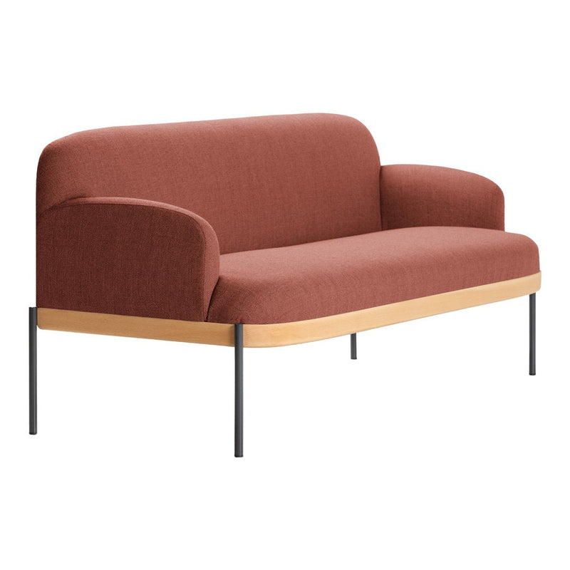 Warm terracotta upholstery on a minimalist sofa with sleek wood and black metal accents. Perfect for modern decor.