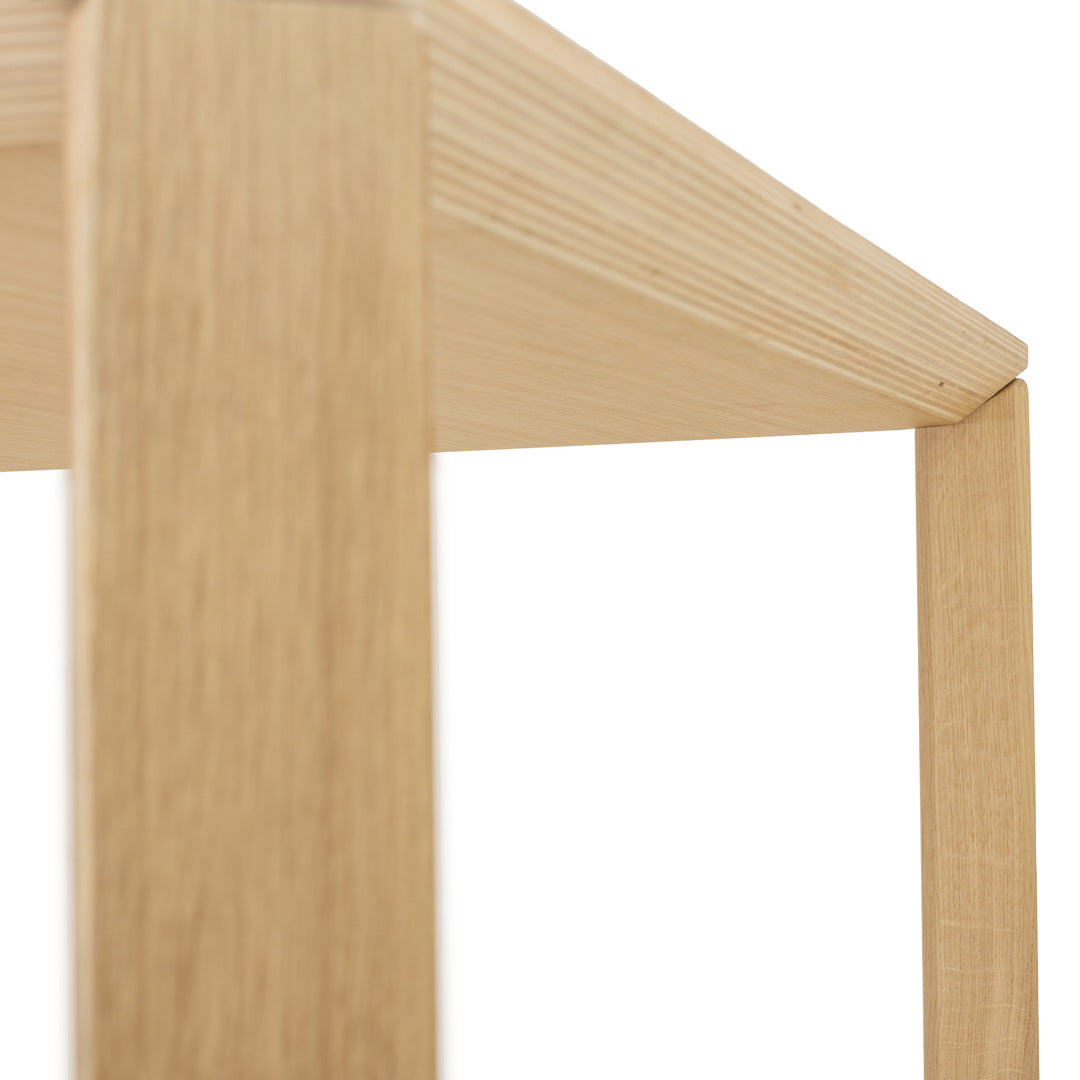 Light oak wood table with clean lines and a natural finish, showcasing a smooth surface and minimalistic design.