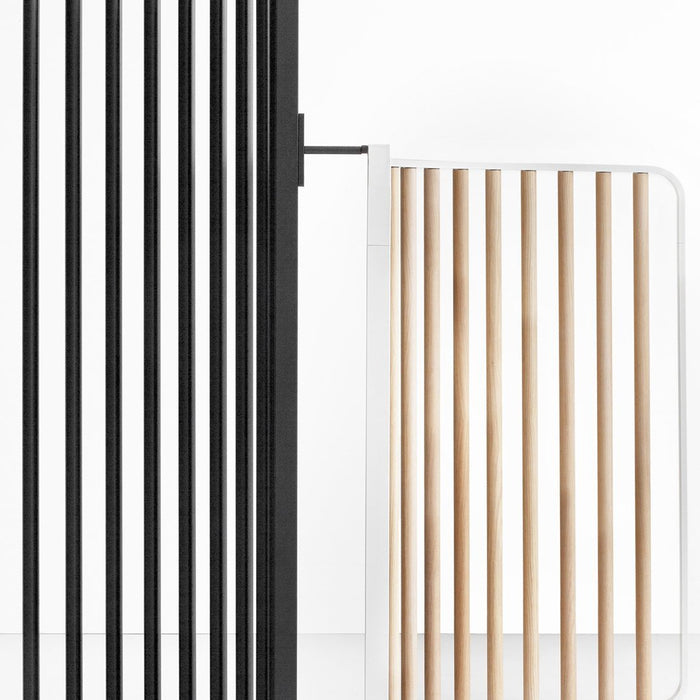 Black and white vertical slats with natural wood accents, showcasing a modern, minimalist design.