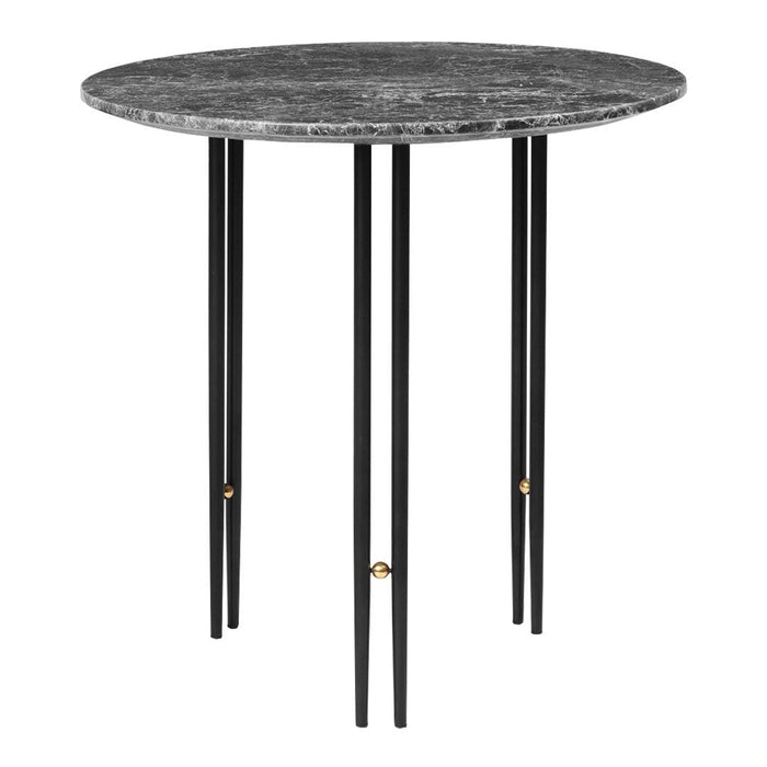 Round black marble top table with sleek black legs and golden accents. Modern design for stylish interiors.