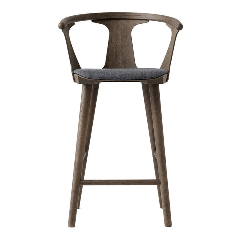 Gray upholstered seat with a light brown wooden frame, minimalistic design, and smooth finish.