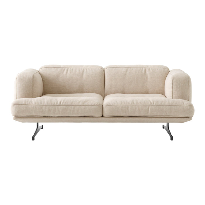 Beige sofa with a minimalist design, featuring soft, textured upholstery and sleek black metal legs.