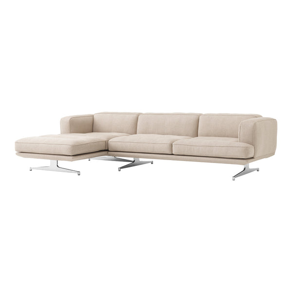 Beige sectional sofa with a sleek design and subtle texture, featuring modern chrome legs. Perfect for contemporary decor.