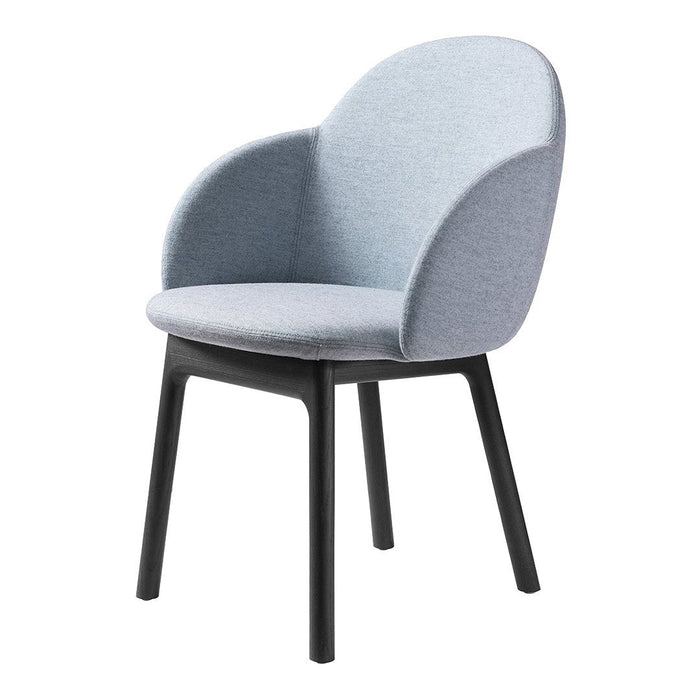 Light blue upholstered chair with a curved back and black wooden legs, perfect for modern decor.