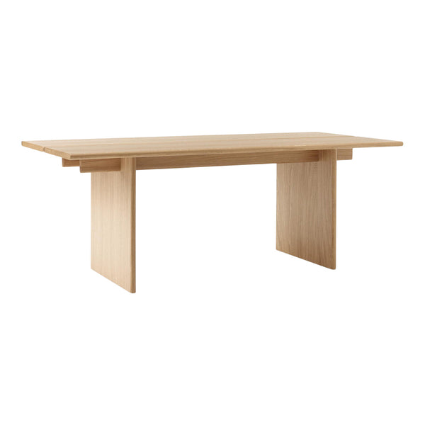Light oak dining table with a minimalist design and smooth, natural wood grain pattern. Perfect for contemporary spaces.