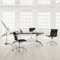 Modern black and white office furniture with polka dot patterns, sleek Chrome accents, and bright airy environment.