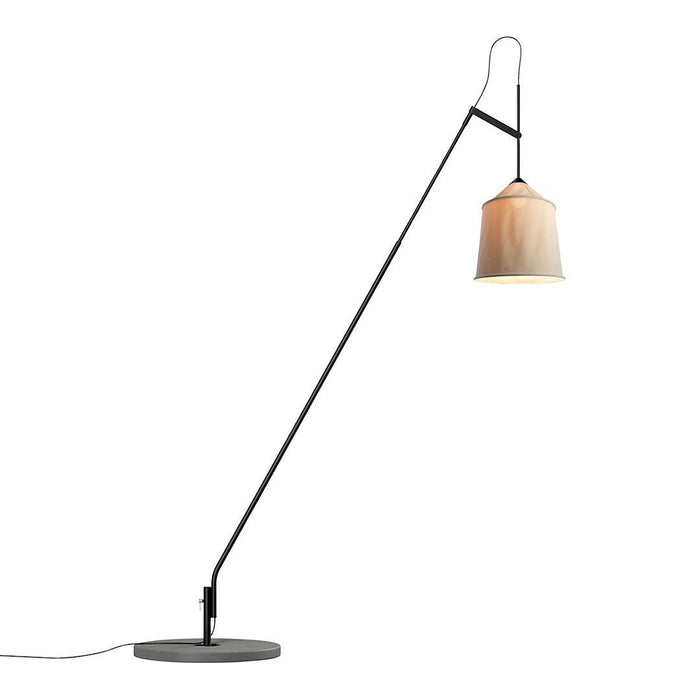 Stylish black floor lamp with a warm beige shade, featuring a sleek modern design and minimalist patterns.