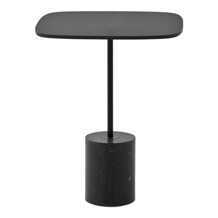 Black table with a sleek, rounded top and cylindrical base featuring a subtle texture. Modern minimalist design.