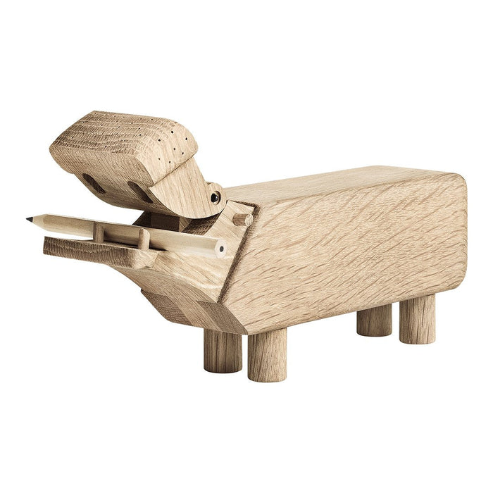 Natural wood pencil holder in a minimalist hippo design, featuring a smooth beige finish and simple geometric shapes.