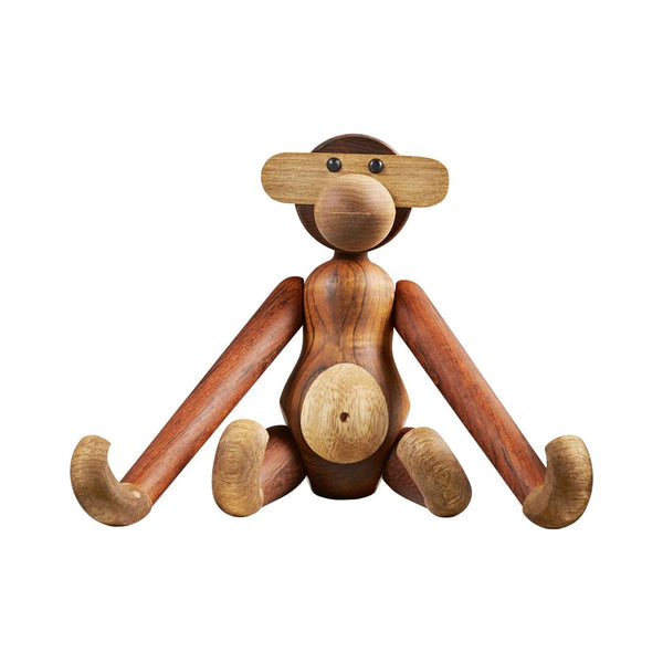 Wooden monkey sculpture in warm brown tones with a smooth finish and contrasting light wooden accents.