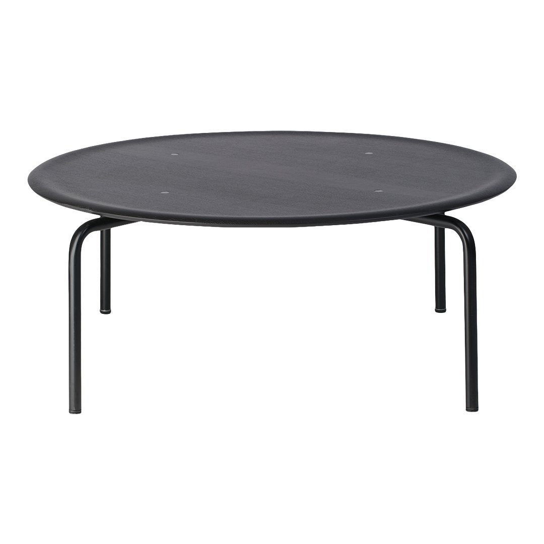 Round black coffee table with a smooth surface and sleek black metal legs, modern and minimalist design.