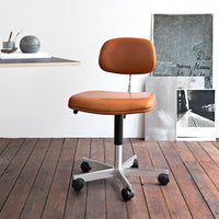 Brown leather office chair with a sleek, minimalist design and chrome base on wooden floor.
