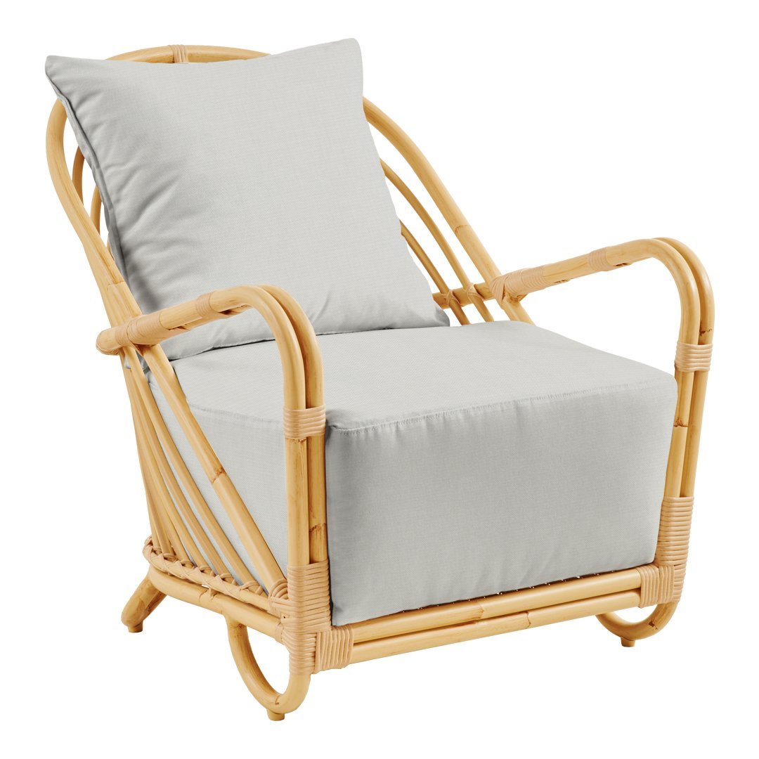 Light gray cushion armchair with a natural rattan frame, featuring clean lines and a minimalistic design.