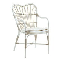 Elegant white wicker chair with natural tan accents and a unique woven pattern, perfect for modern decor.