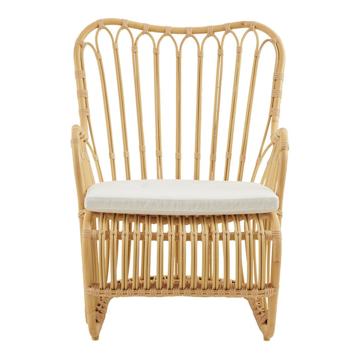 Natural rattan chair with a woven pattern and a solid cream cushion, perfect for rustic or coastal decor.