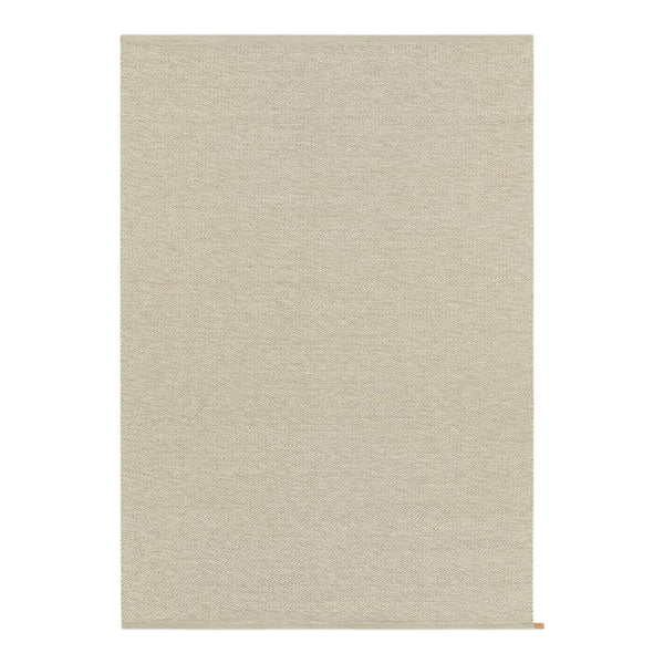 Beige textured rug with a subtle woven pattern, perfect for adding warmth to any space.