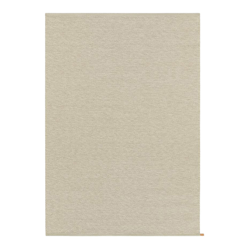 Beige textured rug with a subtle woven pattern, perfect for adding warmth to any space.