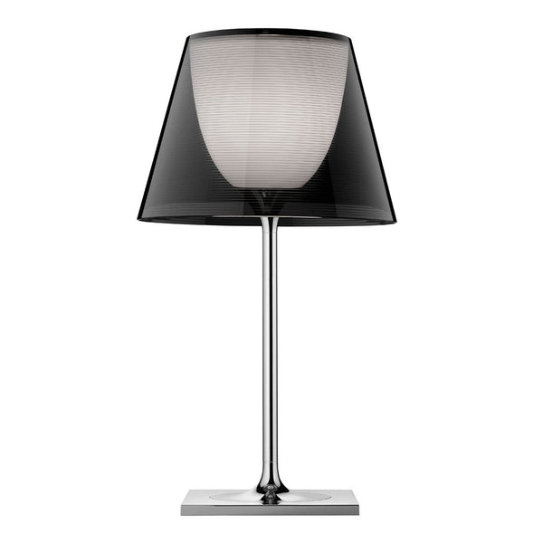 Stylish black and white lamp with a sleek chrome base and patterned shade, perfect for modern decor.