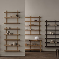"Wooden shelves in natural beige and dark brown, featuring clean lines and minimalist design against warm wall tones."