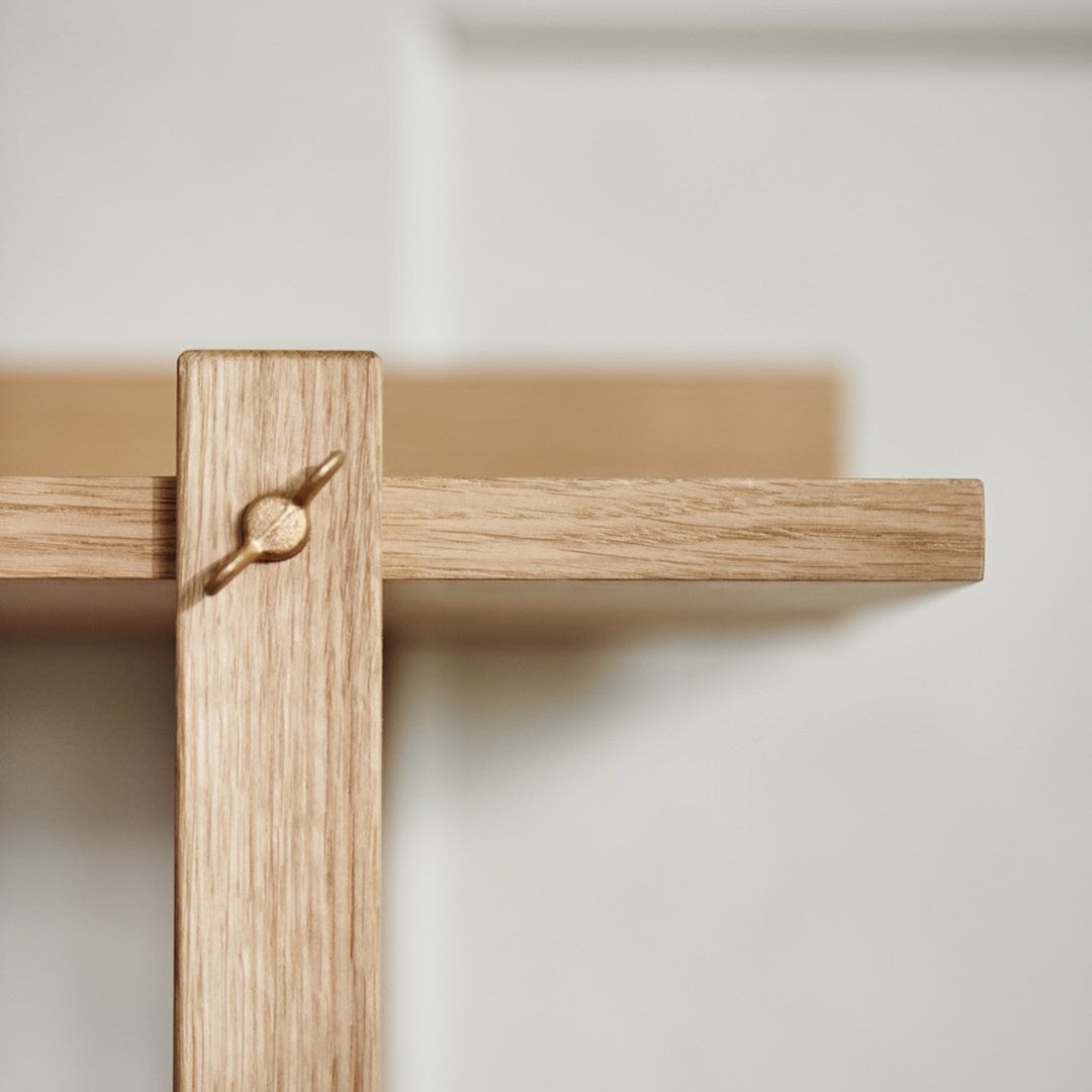 Light oak wood shelf with a minimalist design and subtle grain texture. Perfect for any modern décor.