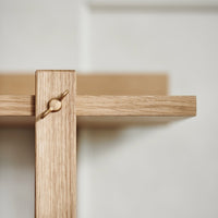 Light oak wood shelf with a minimalist design and subtle grain texture. Perfect for any modern décor.