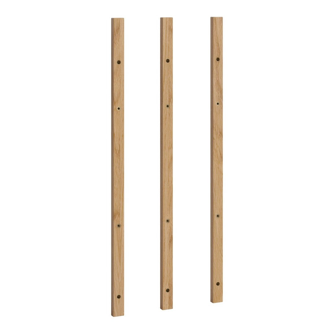 Three vertical wooden slats in light natural oak finish with a smooth surface and uniform grain pattern.