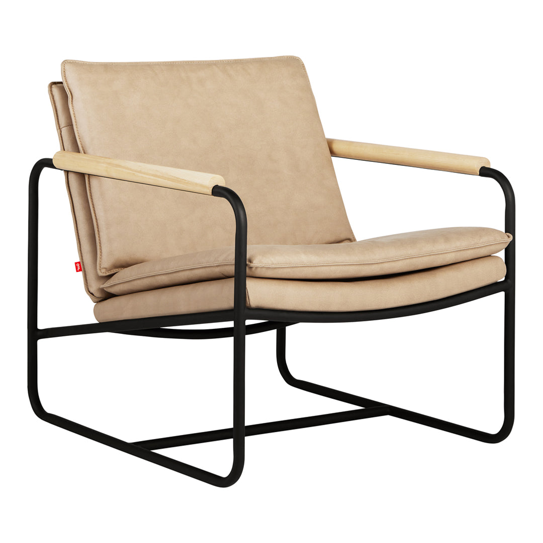 Beige leather armchair with black metal frame and natural wood accents, featuring a minimalist design.