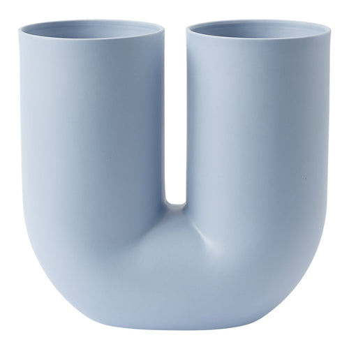 "Light blue U-shaped ceramic vase with a smooth matte finish and minimalist design."