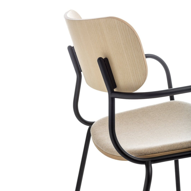 Beige fabric seat with natural wood backrest and sleek black metal frame, combining modern and minimalist design elements.