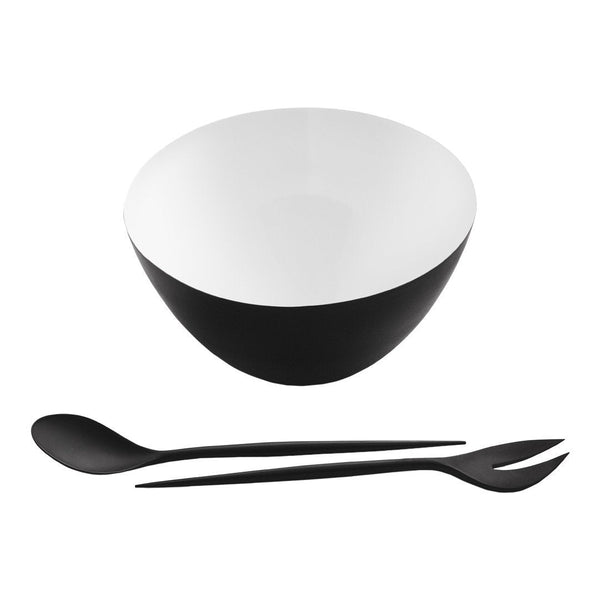 Black and white serving bowl with sleek matte finish, accompanied by a black spoon and fork set.