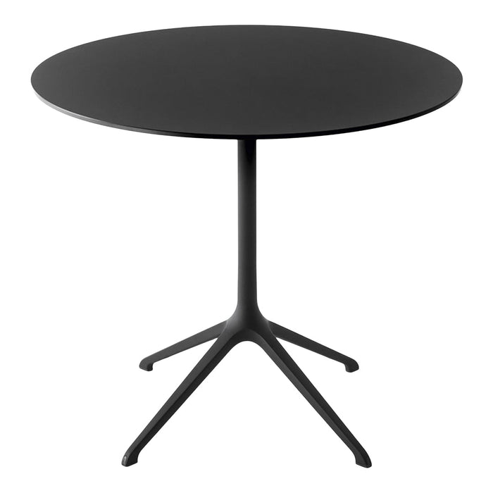 Round black table with a sleek matte finish and minimalist design, featuring a simple, modern silhouette.
