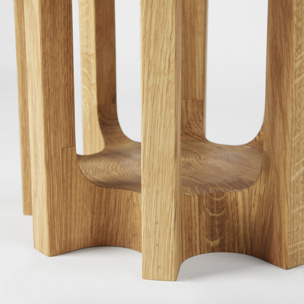 Light oak wood stool with smooth grain, featuring a minimalist design and natural finish. Perfect for modern decor.