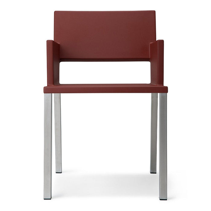 Modern red chair with a sleek design and stainless steel legs, perfect for contemporary interiors.