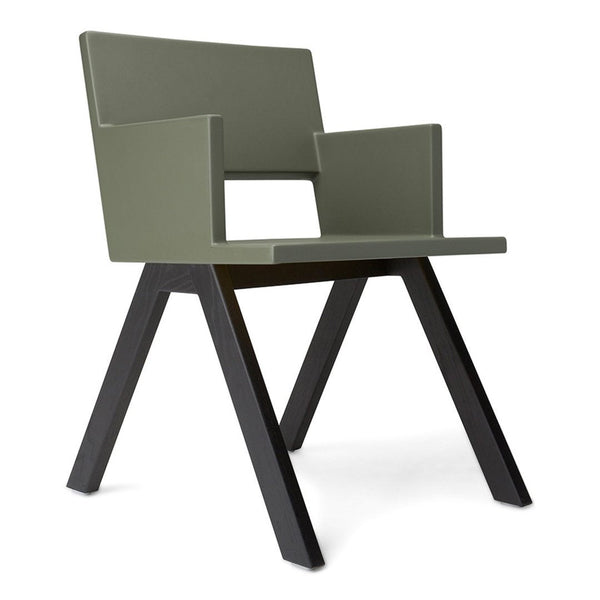 Modern green armchair with a sleek design and contrasting black legs. Perfect for contemporary decor.