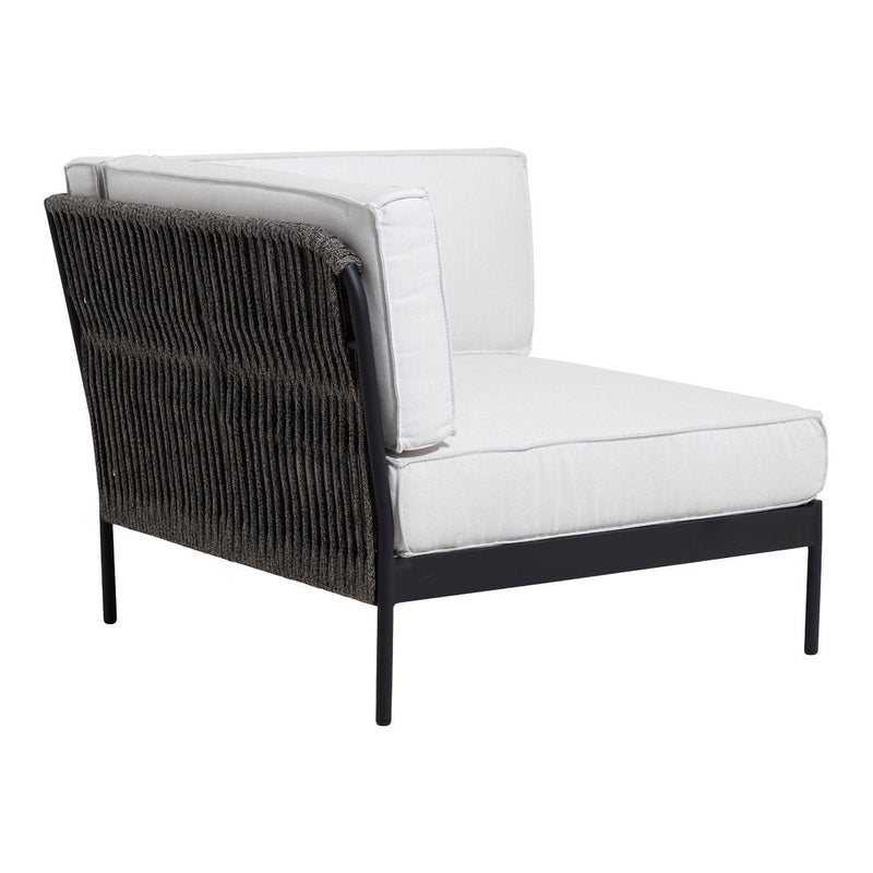 White cushioned chair with a dark woven backrest and sleek black metal frame. Modern, minimalist design.