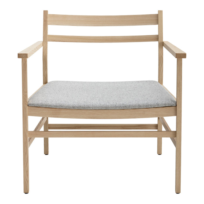 Light wood armchair with a textured gray cushion, featuring a minimalist design and natural finish.
