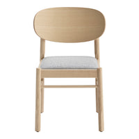 Light wood chair with a simple, oval back and a soft gray upholstered seat, showcasing a minimalist design.