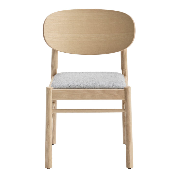Light wood chair with a simple, oval back and a soft gray upholstered seat, showcasing a minimalist design.