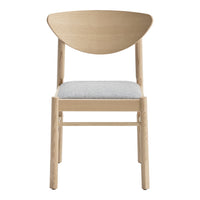 Natural wood chair with a light beige cushion and a unique curved back design. Modern, minimalist style.