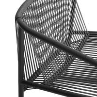 Black woven metal bench with sleek lines and unique tubular pattern, perfect for modern outdoor spaces.