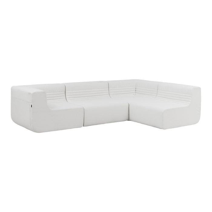 Modern white sectional sofa with sleek lines and textured ribbed pattern for contemporary living spaces.