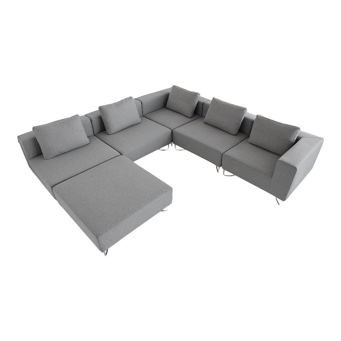L-shaped grey sectional sofa with soft fabric and plush cushions, featuring a modern minimalist design.